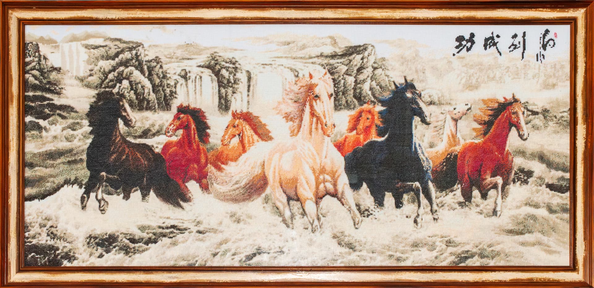 Eight horses galloping through snow, hand-embroidered panorama in a gilt frame