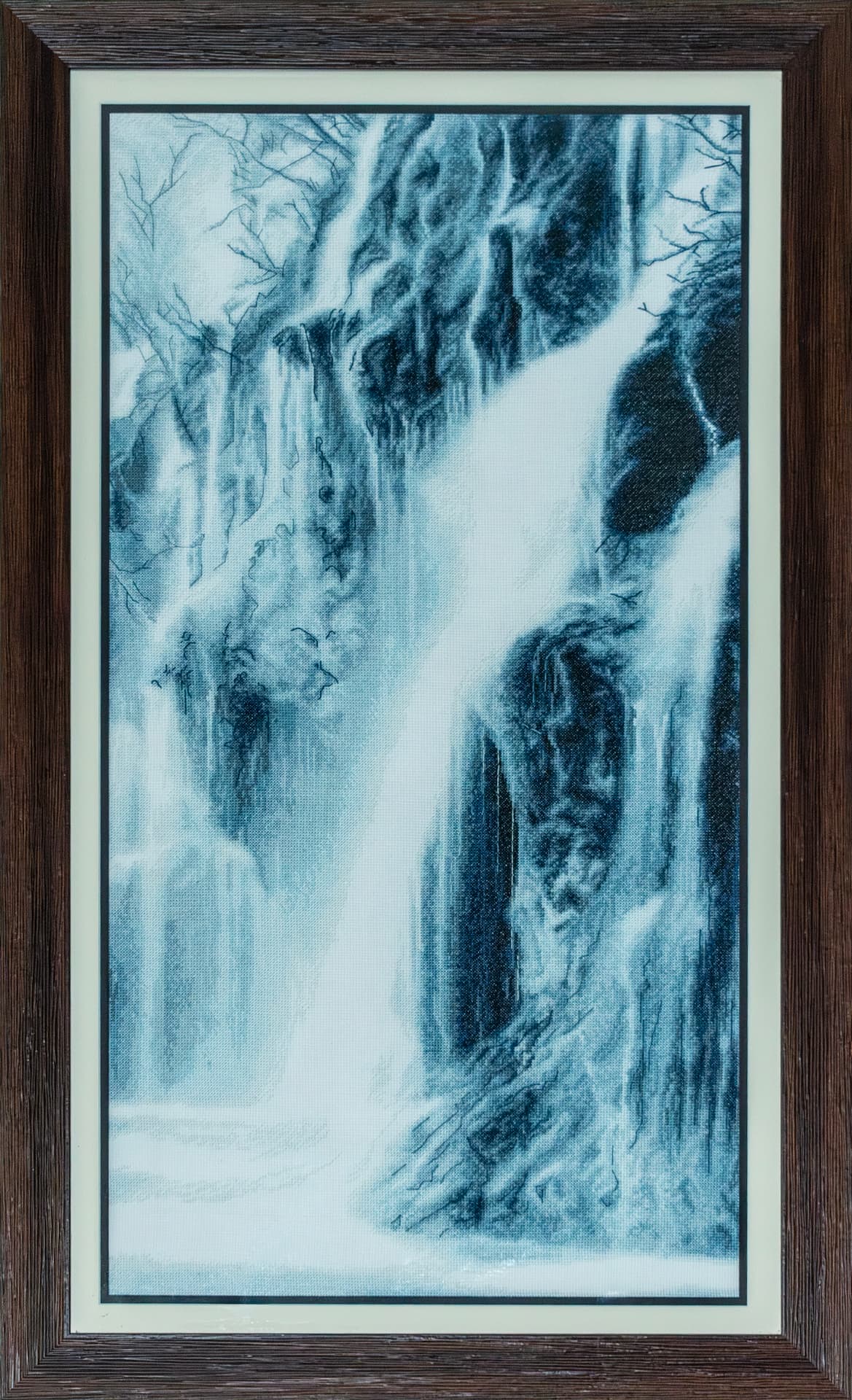Embroidered waterfall in blue monochrome, dark frame