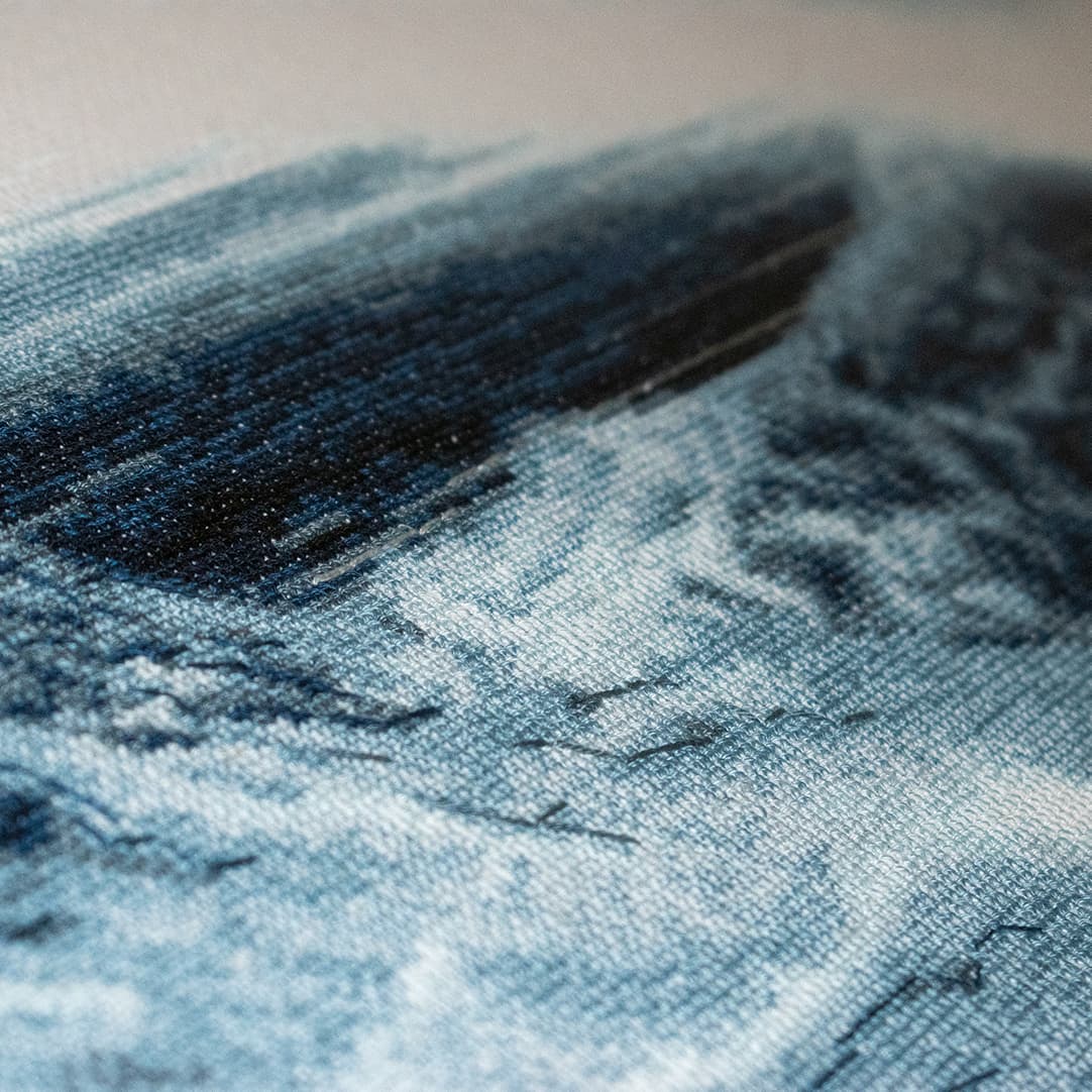 Close-up fragment of “Waterfall”: the texture of hand-stitched crosses