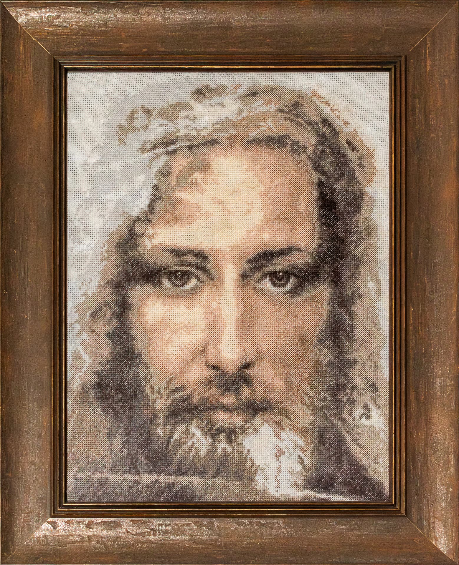 Sepia hand-embroidered face of Christ in an oak frame