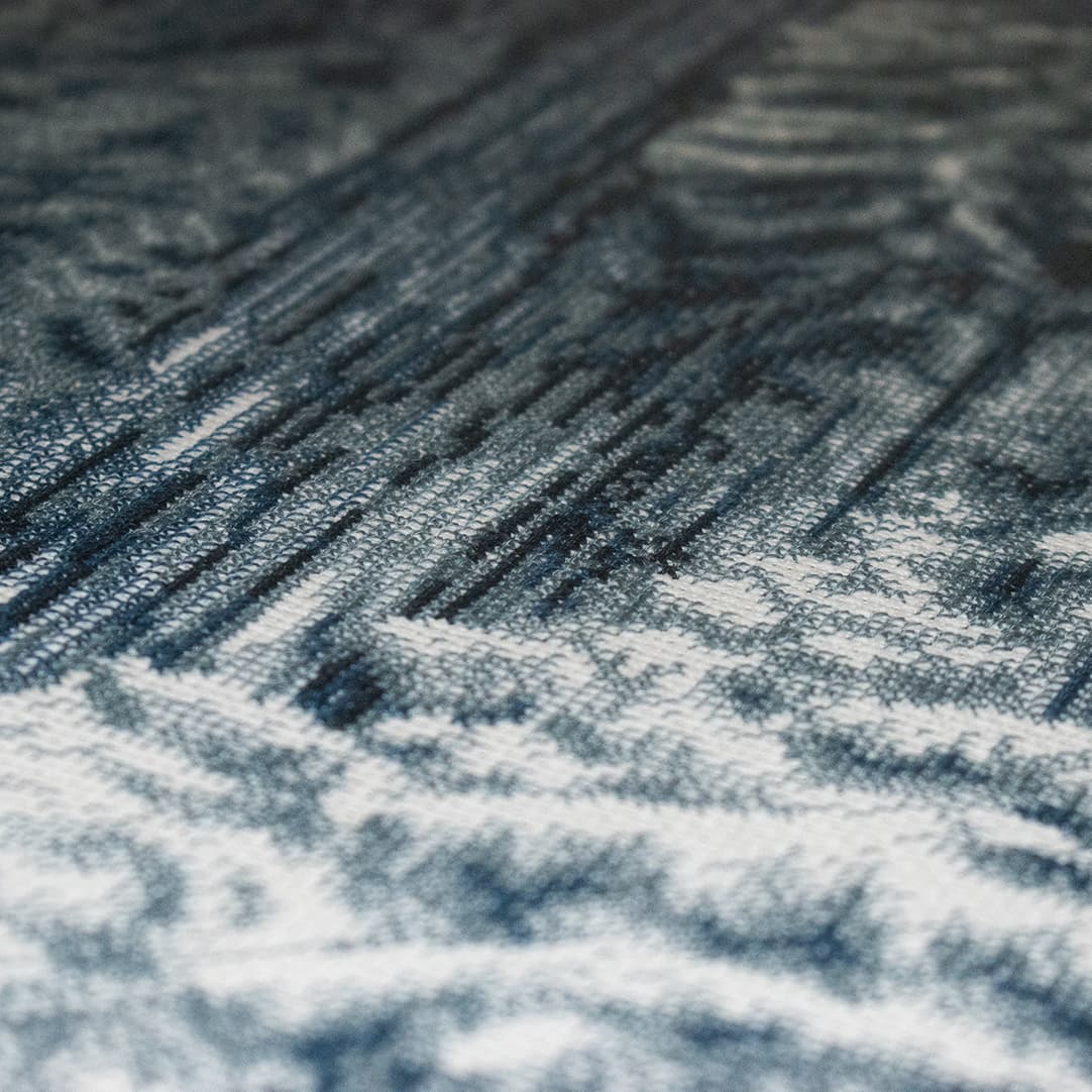 Close-up fragment of “Winter Firs”: the texture of hand-stitched crosses