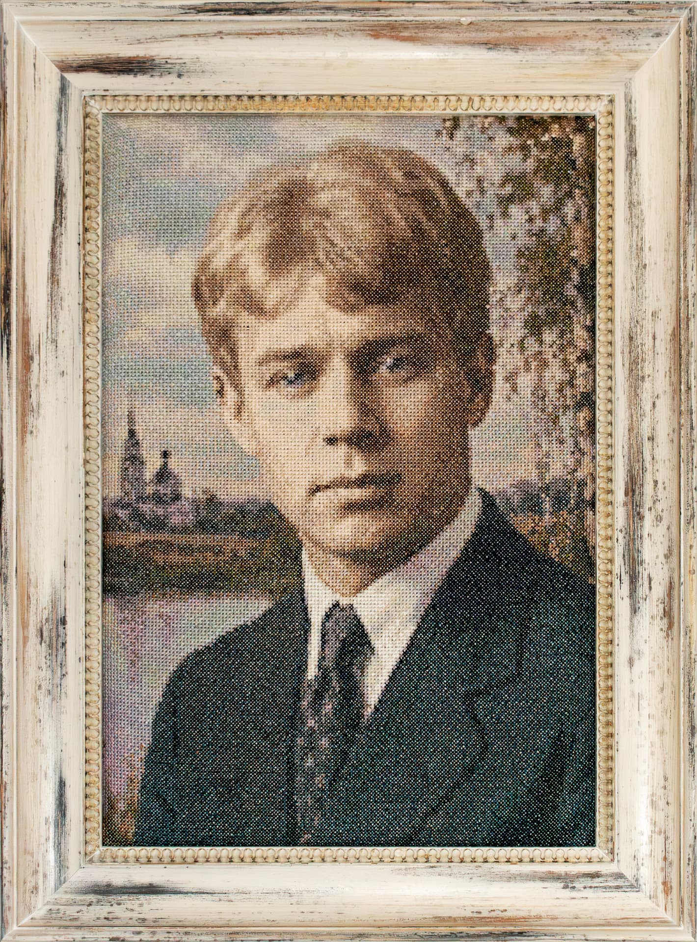 Hand-embroidered portrait of Sergei Yesenin in a whitewashed frame