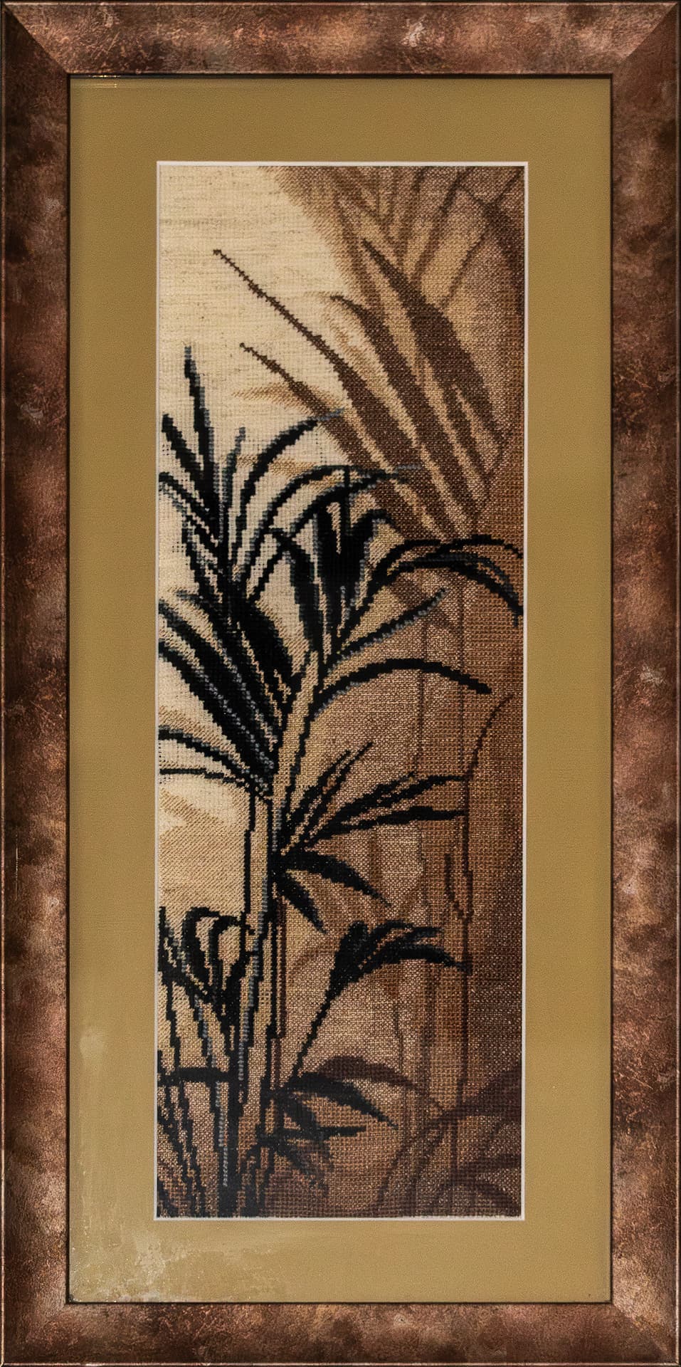 Left panel of an embroidered palm triptych in a bronze frame