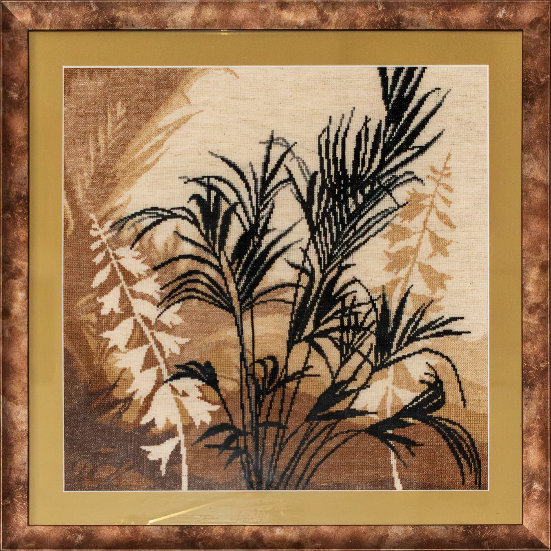 Centre panel of an embroidered palm triptych in a bronze frame
